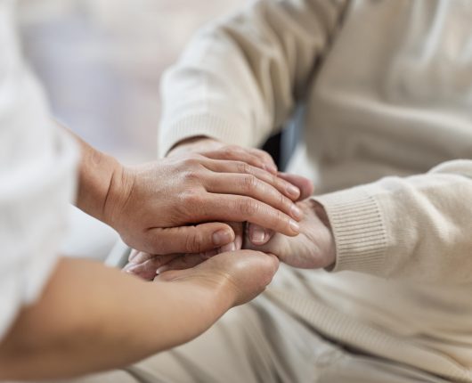 doctor-holding-hands-with-senior-patient_2