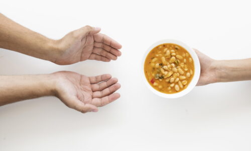 hand-giving-soup-bowl-needy-person_2