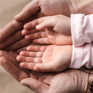 top-view-little-girl-putting-her-hands-father-s-hands_2